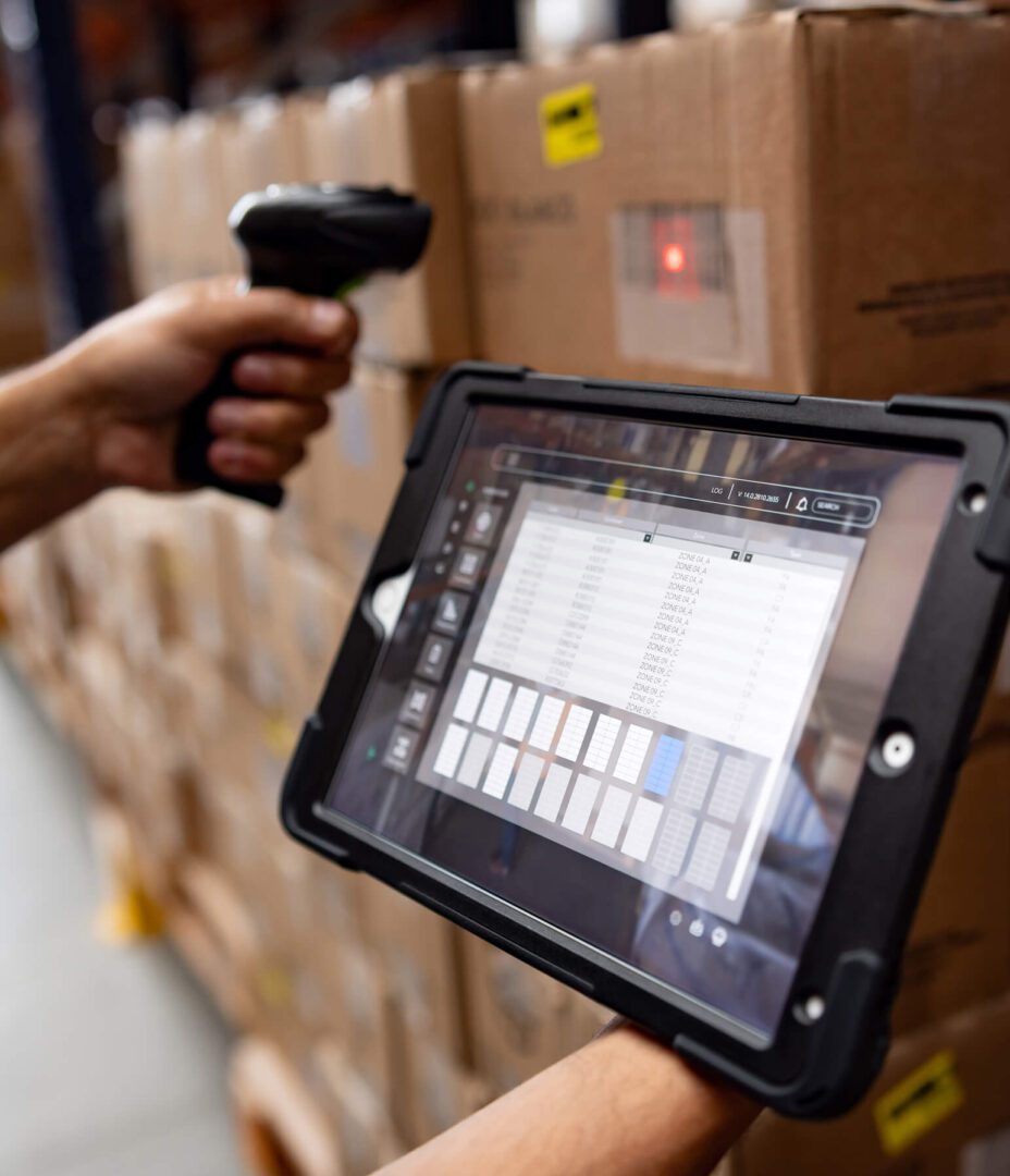 Tablet scanning inventory in a warehouse.